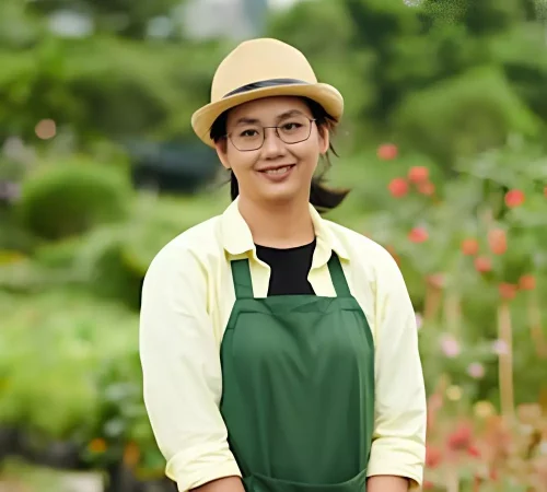 mujer-joven-que-trabaja-vivero-flores_274689-36362.webp